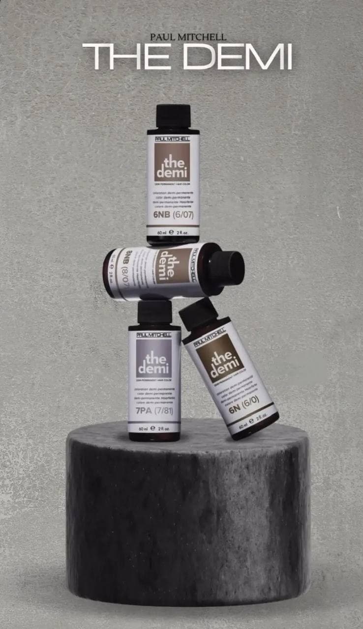 Флаконы деми-перманентного красителя Paul Mitchell the Demi на каменной подставке